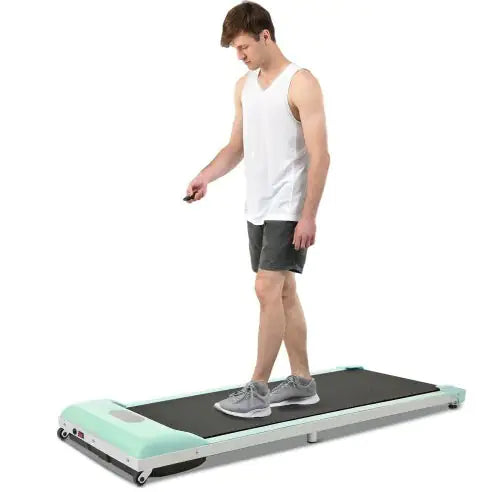 Compact green under-desk treadmill with remote control, LED display & quiet motor for home & office fitness.